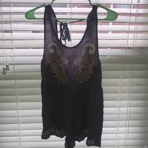 purple romper with design on chest